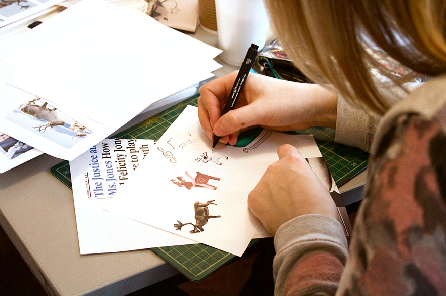 Female student drawing in a workshop.