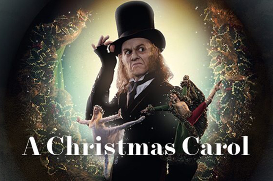 An old man (Scrooge) with a tall top hat and fingerless gloves.
