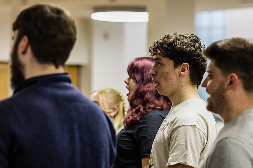 Students singing in a rehearsal.