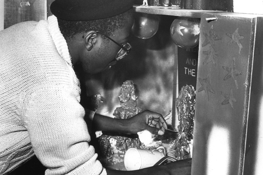 A man working on artwork.