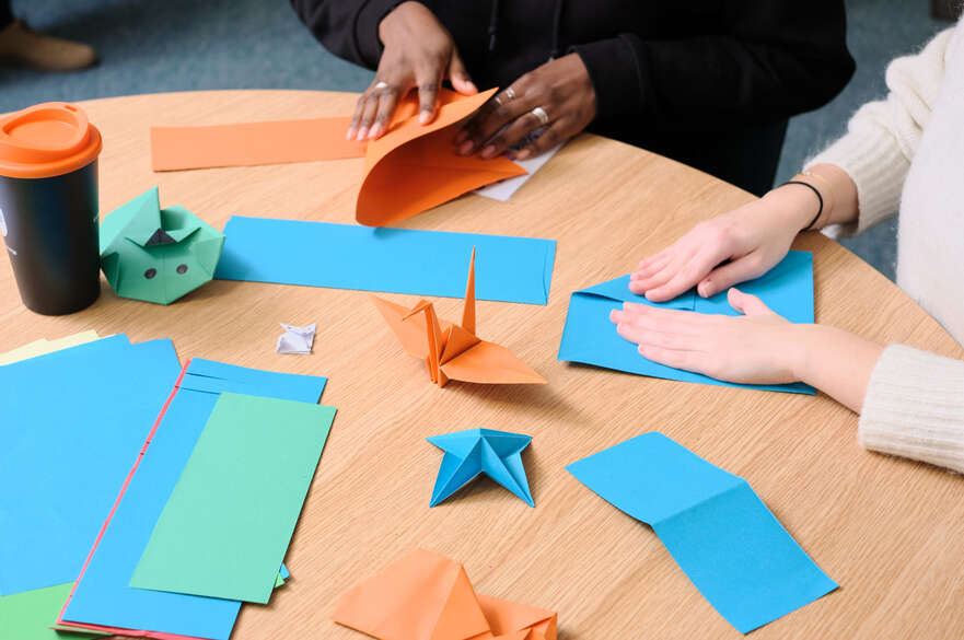 students making paper origami during crafternoon sessions at the global lounges