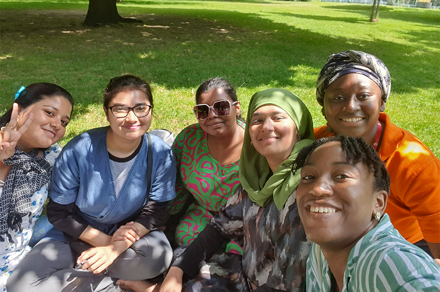 group of female students having a picnic at the arboretum