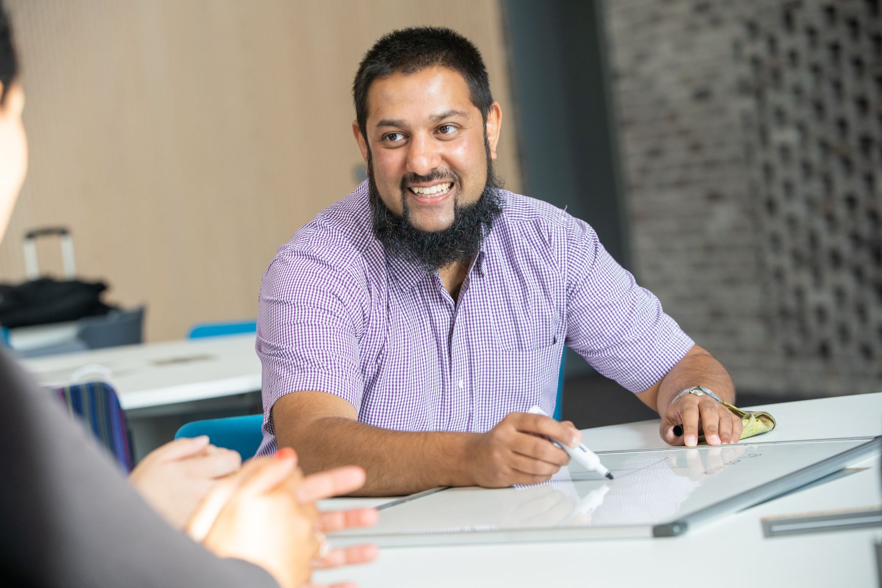 Mustafa Sarkar sitting at desk