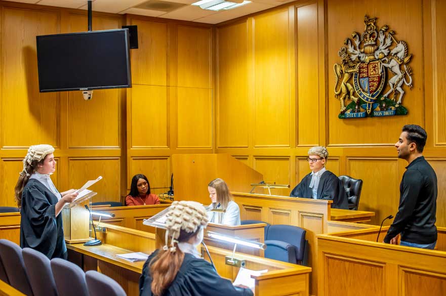 Image of the NLS courtrooms with students presenting