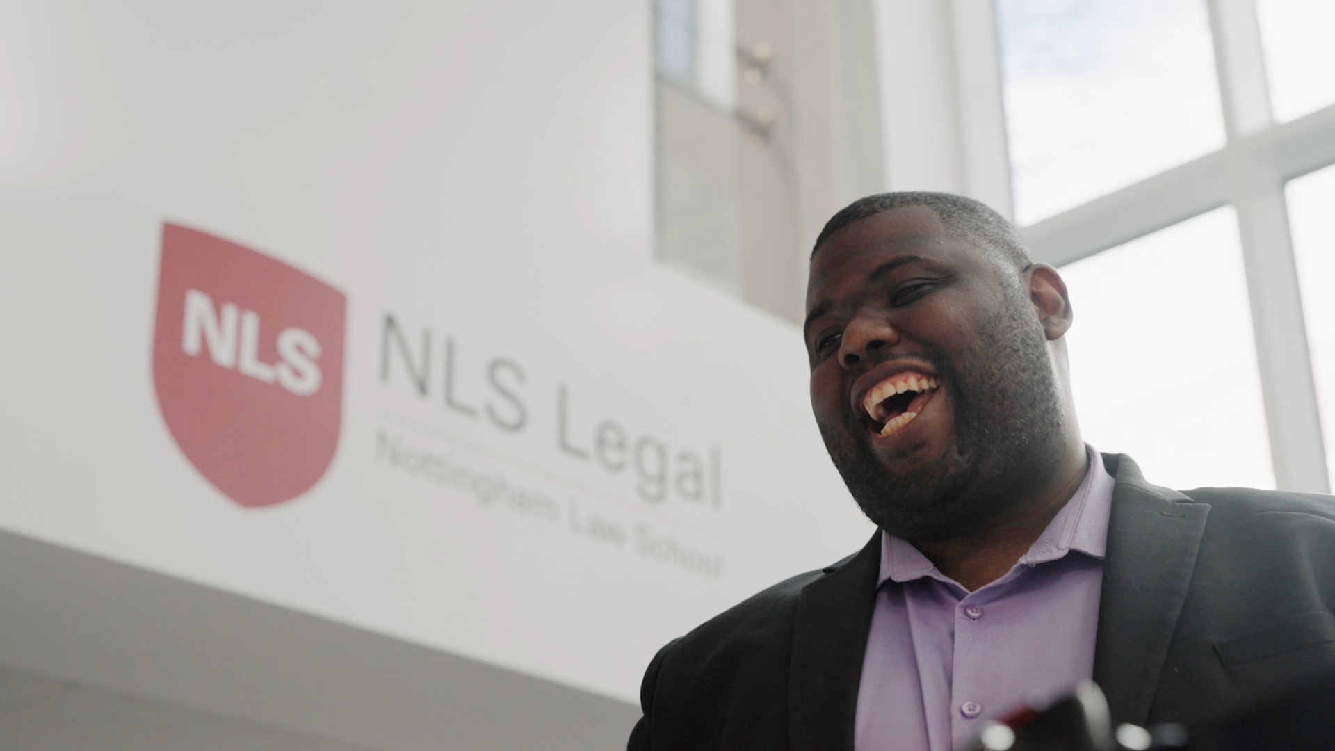 Student laughing in NLS Legal