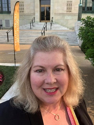 Dr Janice Denoncourt stands before the National Academy of Science (NAS) building in Washington, D.C., USA