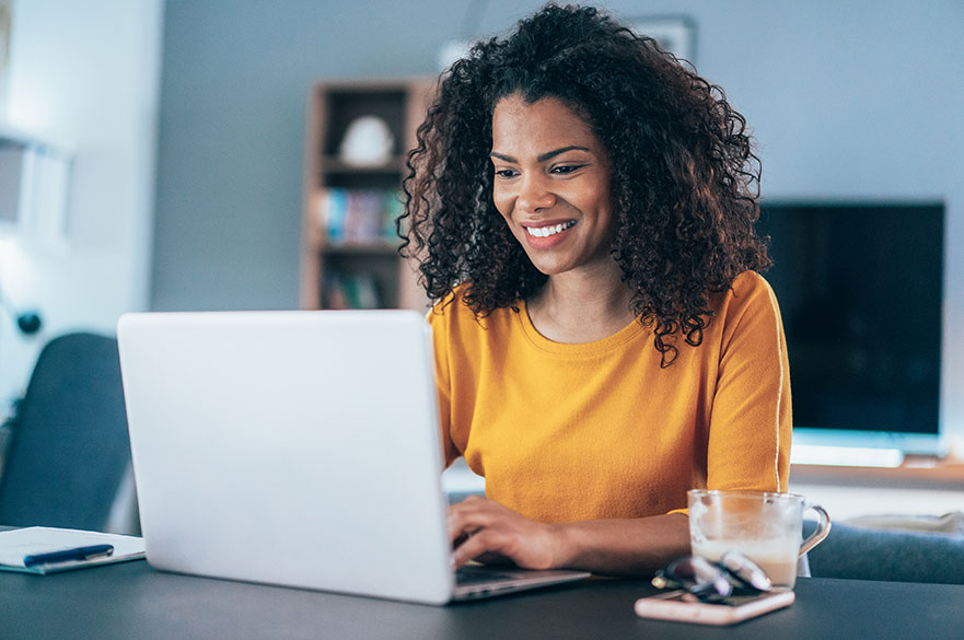 Woman sat at a laptop