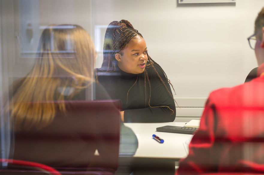 Students working together at a desk
