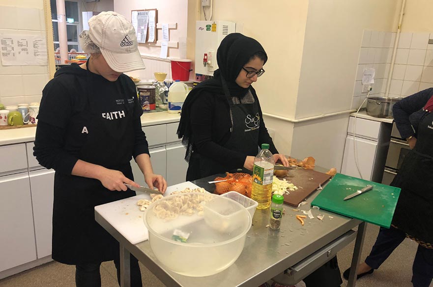 Preparing food at the Muslim and Jewish community café, Salaam Shalom