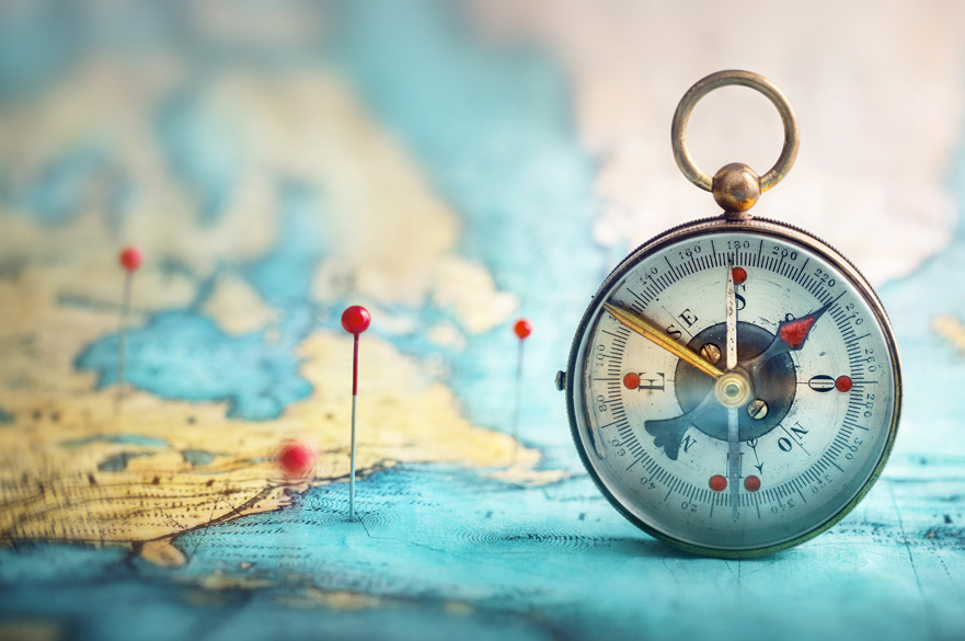 Compass with locations marked on a map