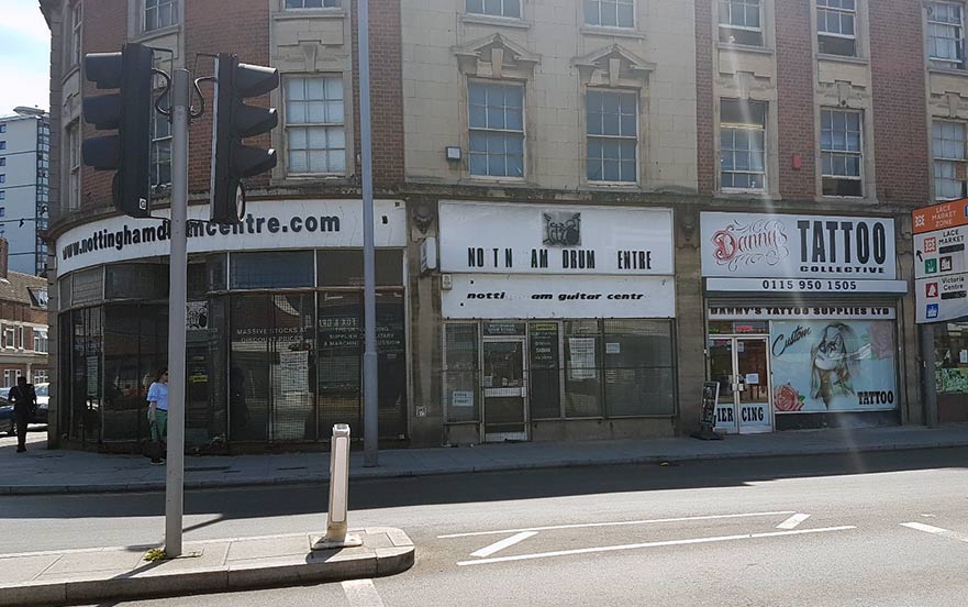 Nottingham city street scene, disused retail units and traffic lights