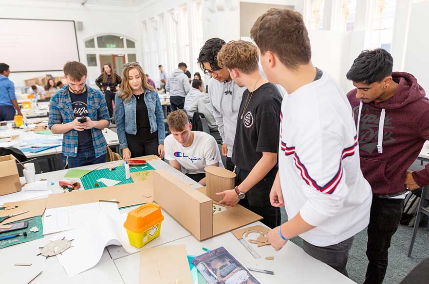 New Architecture students working on the design charrette
