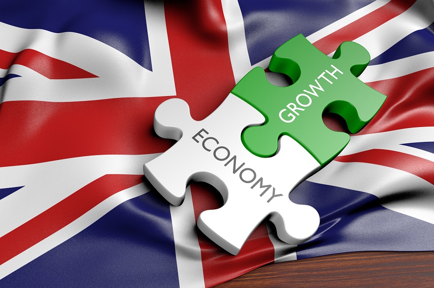 Union Jack with economy and growth jigsaw pieces