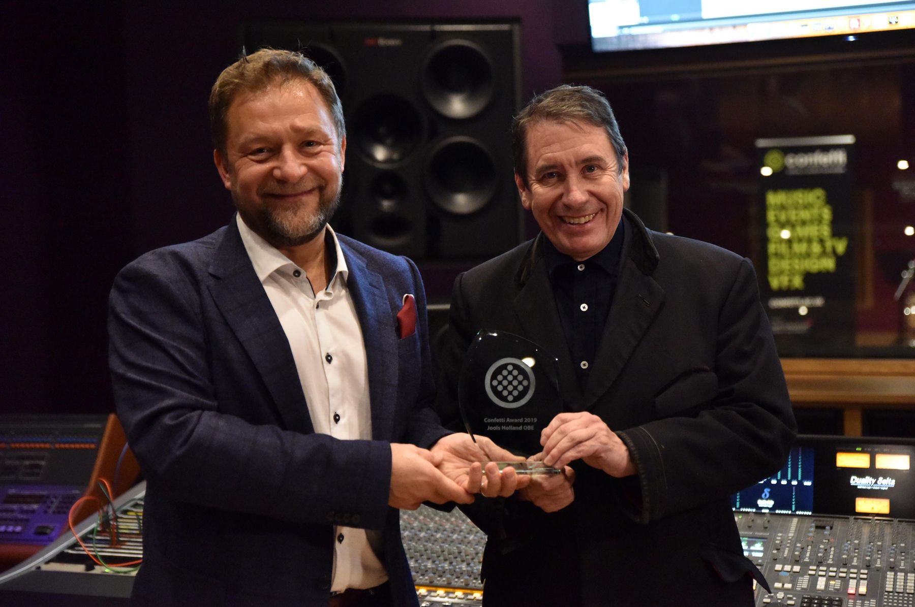 Craig Chettle and Jools Holland with award