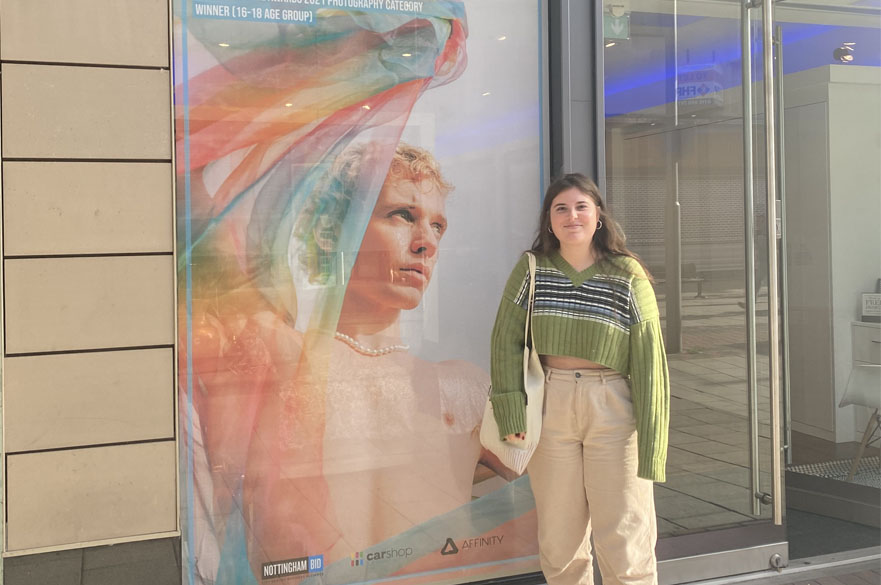 Rosie Baird standing in front of her YCA work