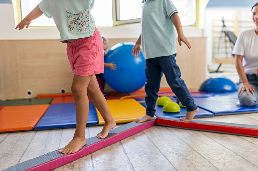 Children balancing on a beam