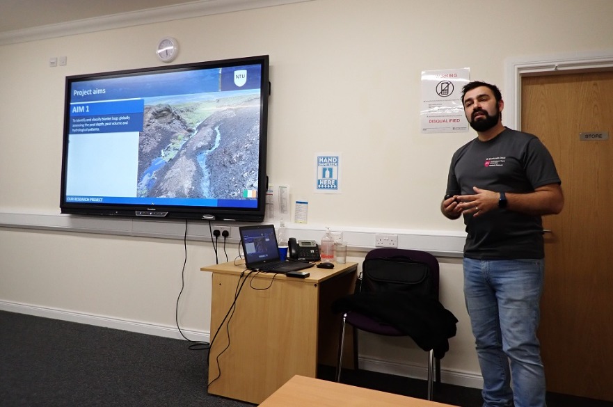 Dr Guaduneth Chico delivering a talk on the peatland project