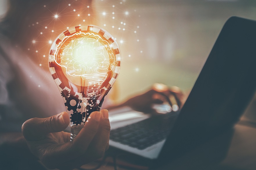 Business women hand holding light bulb, concept of new ideas with innovation and creativity