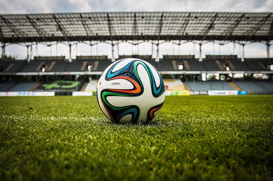 A football on a football pitch.