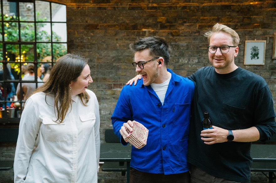 Sam Russel and industry professionals laughing