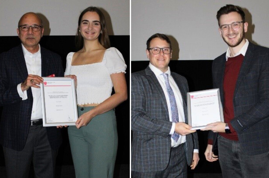 Hannah and Gran accepting their awards next to two NTU academics