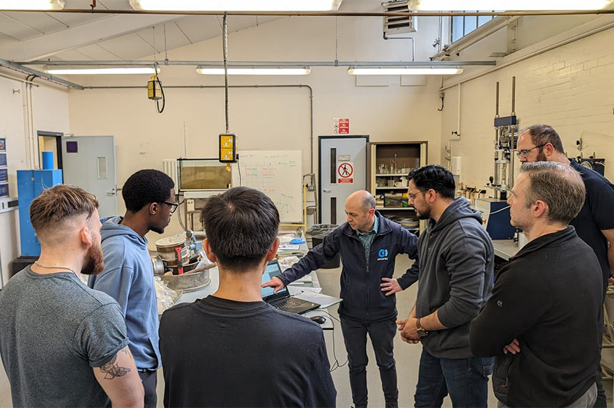 Students and academics working inside NTU's Geotechnical lab.