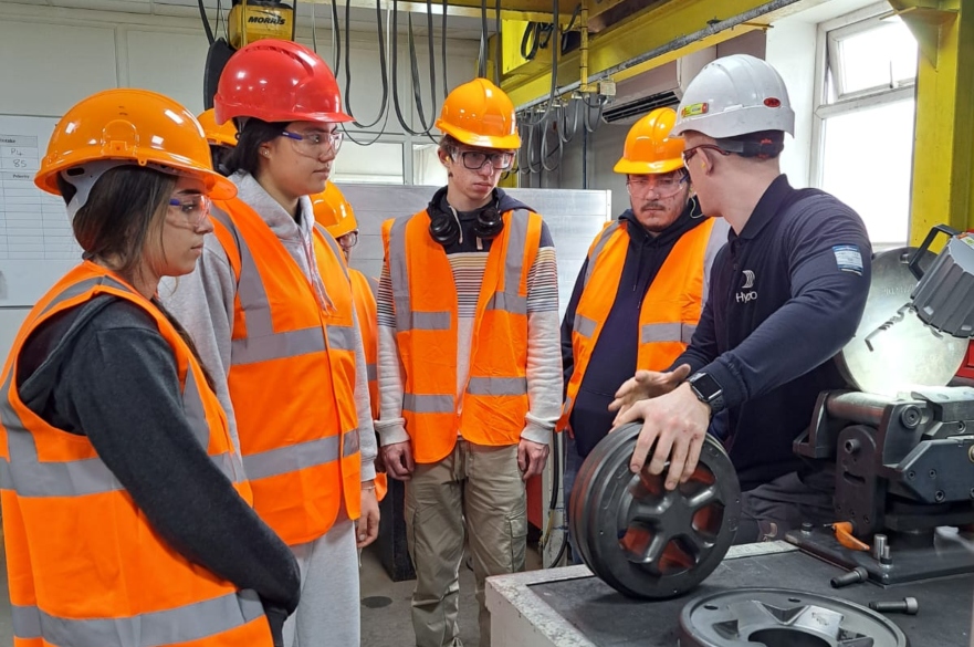 Students wearing PPE watching demonstration