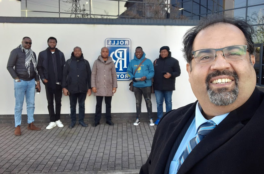 The delegation of Nigeria posing for a picture in front of the Rolls Royce offices in Derby