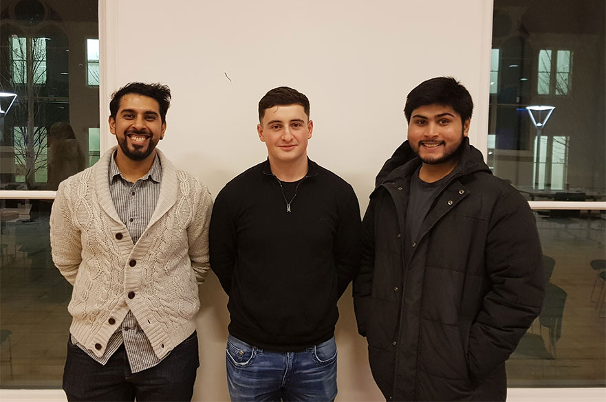 Students posing and smiling at the camera