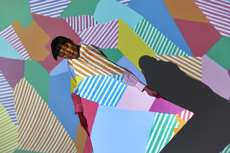 A Liberty Fabrics pattern is projected onto a model