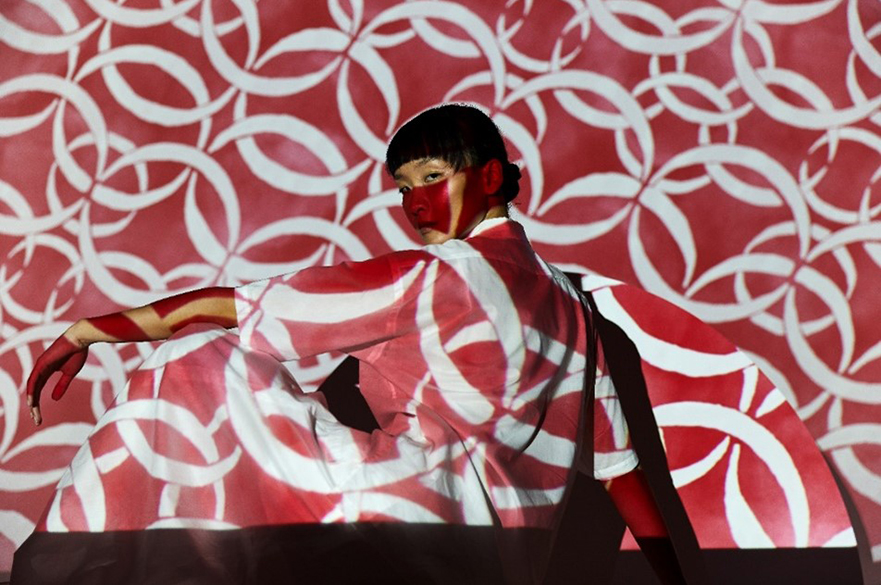 A Liberty Fabrics pattern is projected onto a model