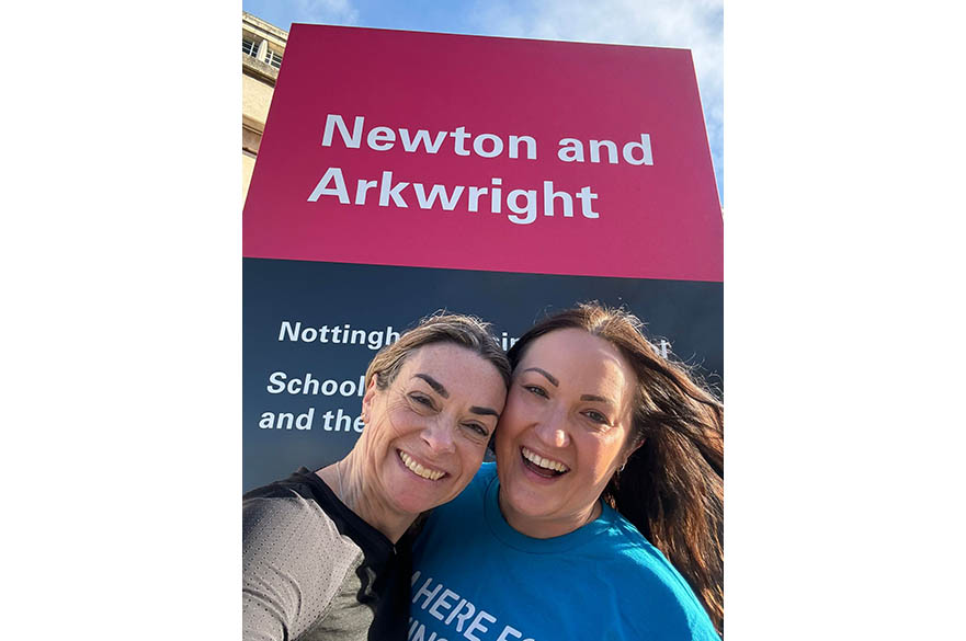 Ange Vickerstaff and Sophie Johnson by the Newton Arkwright sign