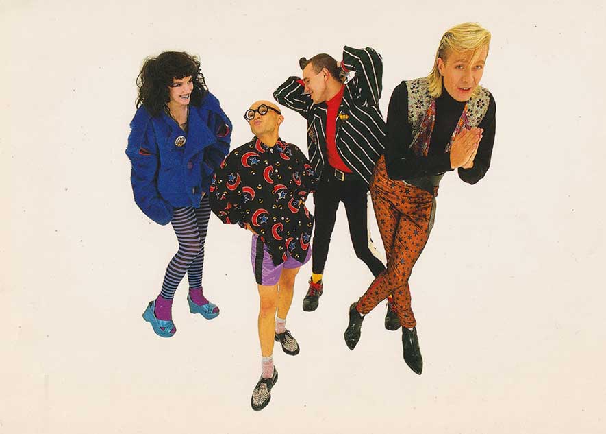 4 figured wearing bright 1980s fashion