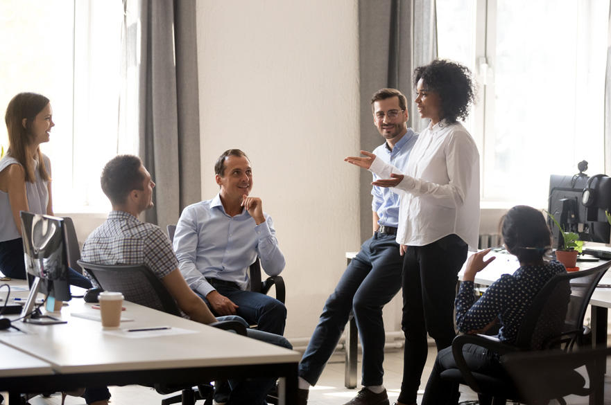 Manager talking to a group of staff