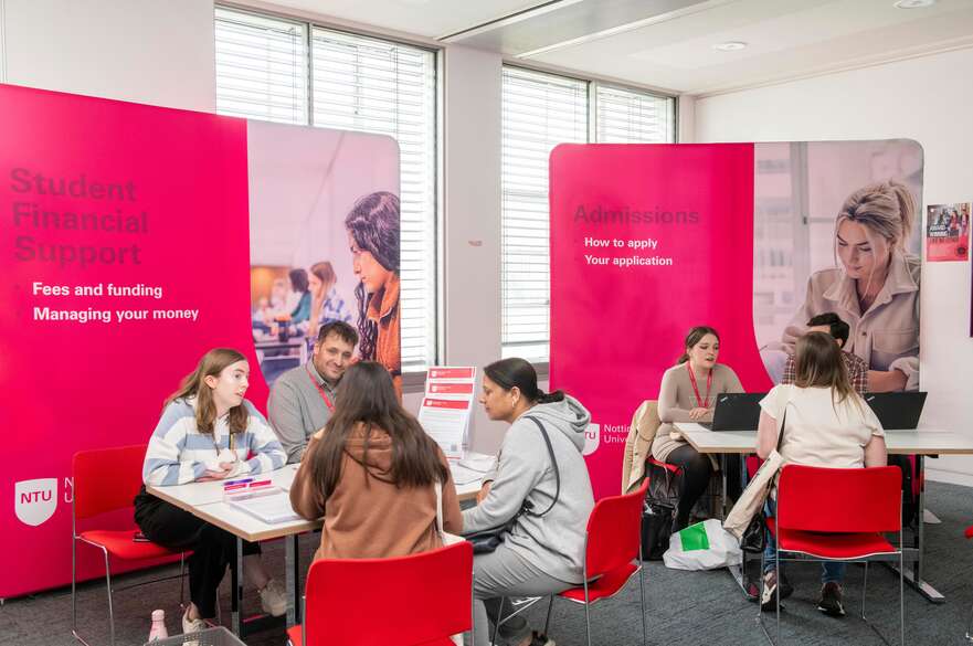 Visitors at finance and admission stands at our postgraduate open event