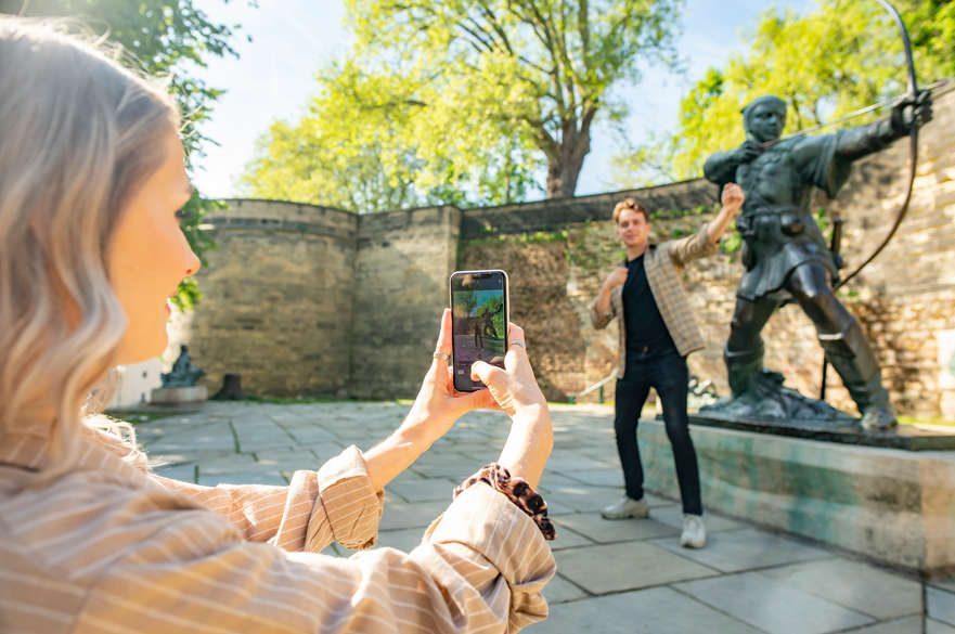Taking a picture in front of Robin Hood