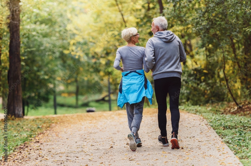 Image of two people running
