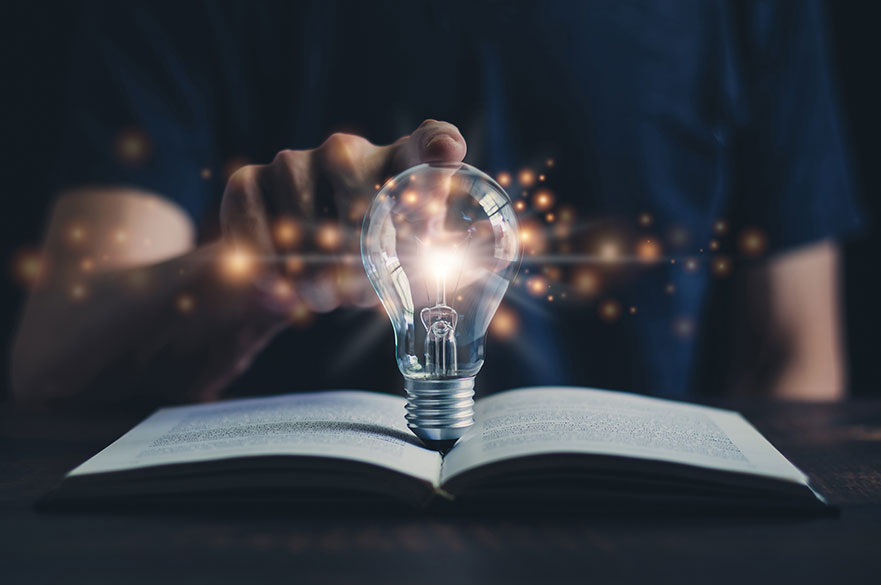 open book with lightbulb 