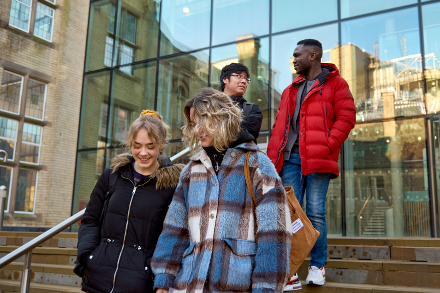 Students walking and smiling in Arkwright