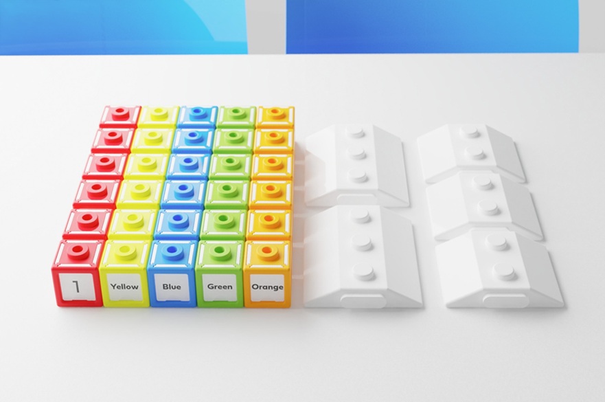 Rows of red, yellow, green and blue bricks, labelled with numbers and colours. Next to them are two long white bricks similar to a Lego brick.