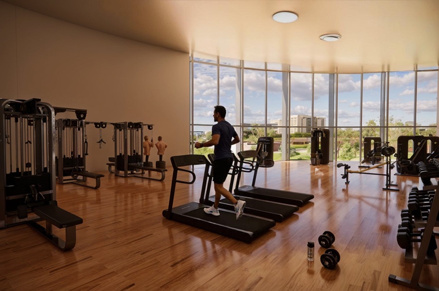 An architect's conceptual image of a gym. A person is running on a treadmill. There is gym equipment. Windows look out on to the surrounding area.