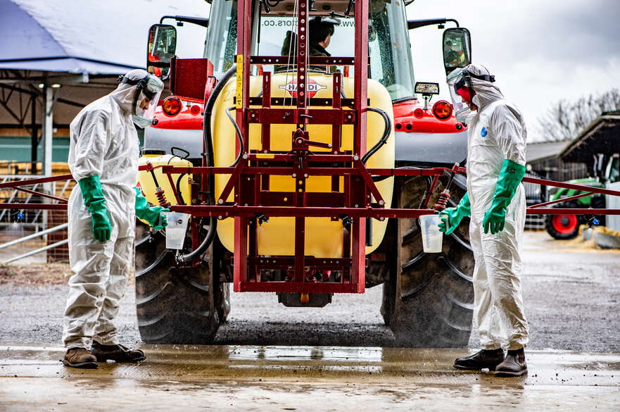 Agriculture students performing spray test on tractor