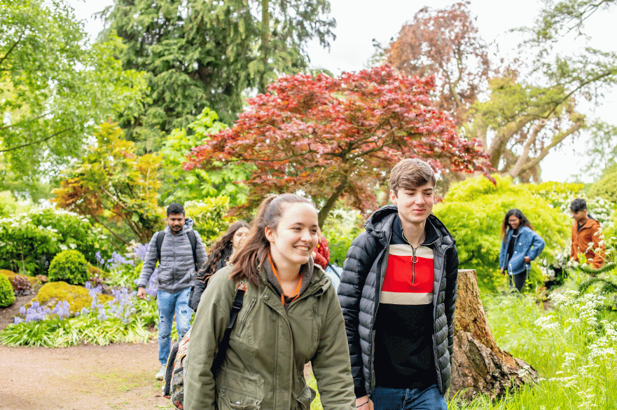 A group of students walking around Brackenhurst Campus