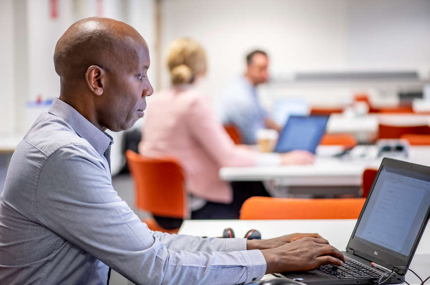 person typing on laptop