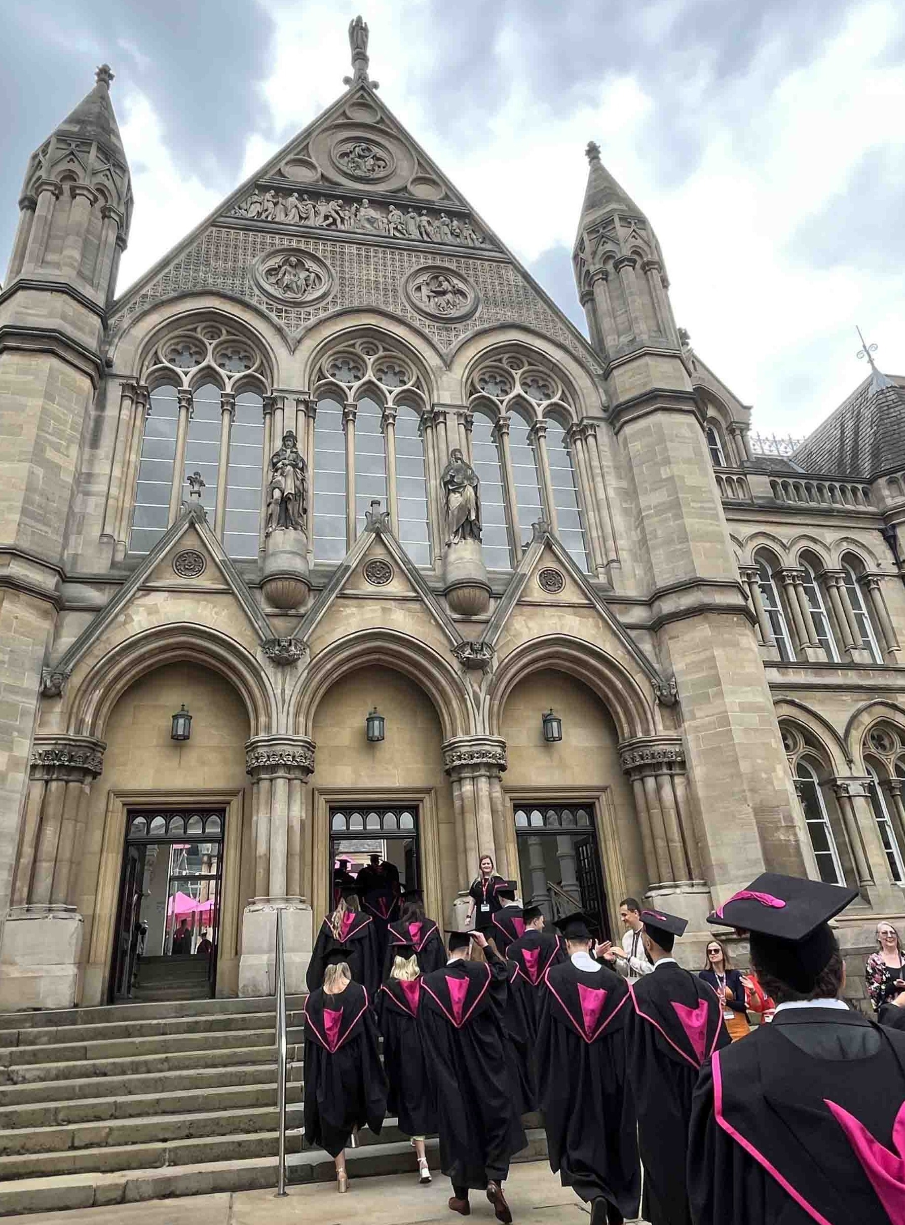 Graduates walking up arkwright steps