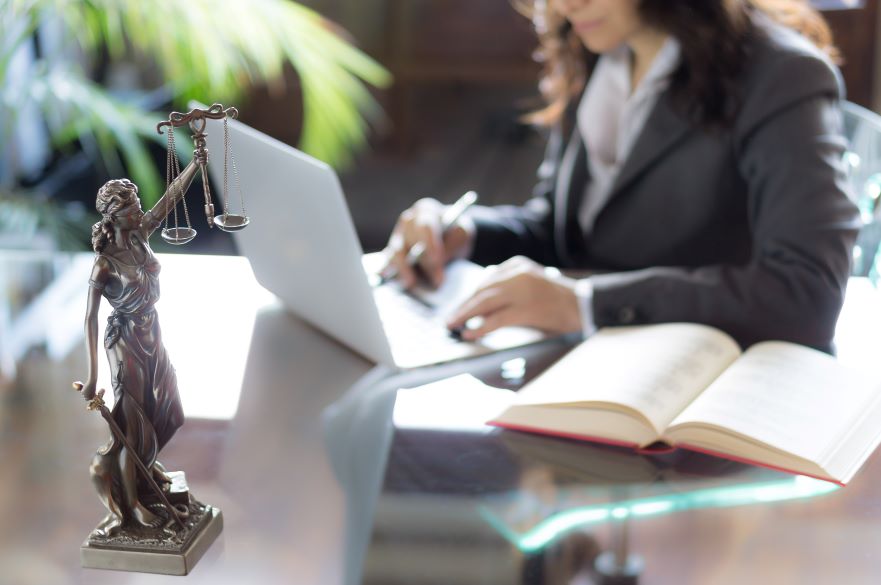 Female Lawyer Looking at Laptop