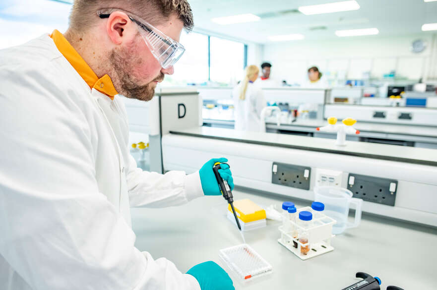 Biochemistry student working in a science lab