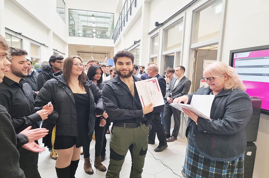 Student Receiving Recognition Certificate