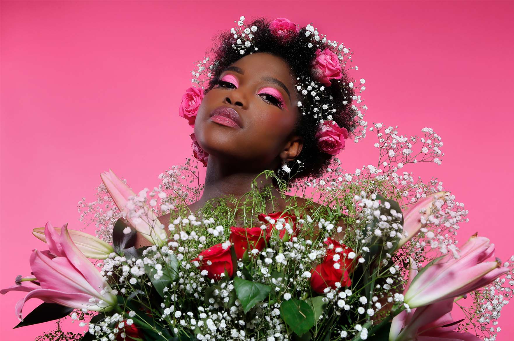 Woman with surrounded by flowers