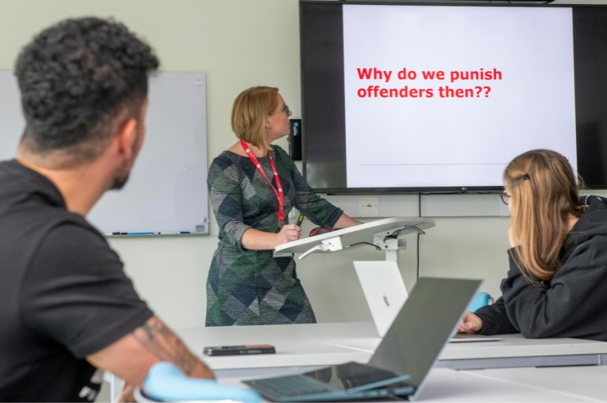 Students and tutor in criminal justice tutorial